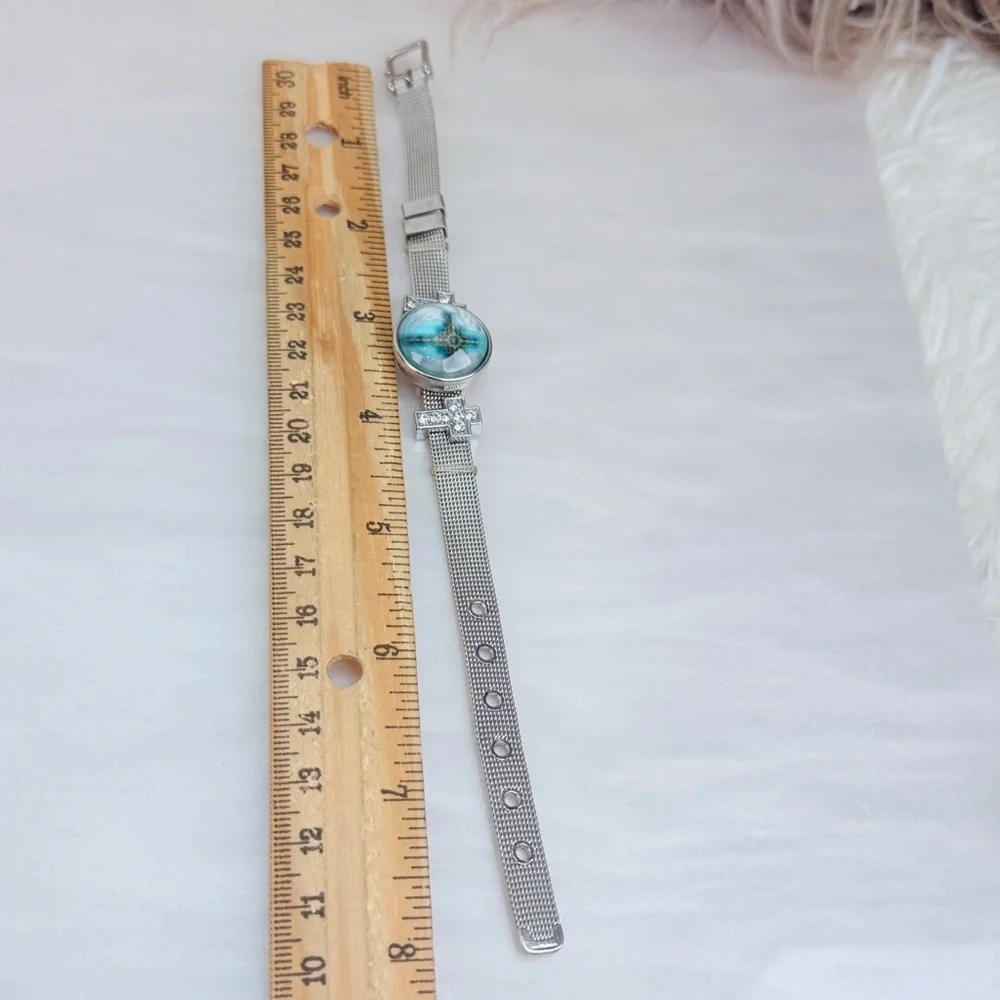 Silvertone Mesh Snap Bracelet with Blue Cross Design